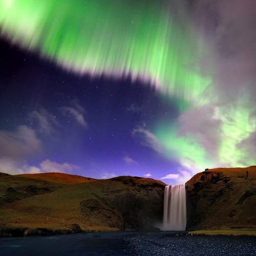 Northern lights above Skogafoss